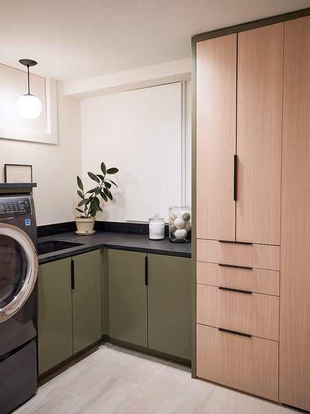 Clever Built-Ins Hide All the Clutter in This Basement Laundry Room